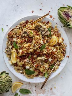 a white plate topped with rice and vegetables