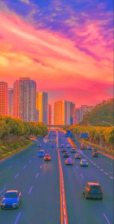 cars are driving down the highway with tall buildings in the backgrouds at sunset