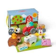 a wooden toy set with farm animals and tractor