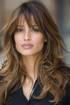 Layered long locks with bangs frame the face beautifully! Here are 49 ideas featuring the most  flattering long hairstyles with layers and fringe for 2024. 👆 Click for more ideas！ Long Hair Cuts With Layers Wavy, Jlo Bangs, 2024 Hair Trends For Women With Bangs, Hairstyles For Long Hair 2024, Long Hair Layers With Bangs, Long Bangs 2024, Face Framing Layers With Bangs, Long Hair With Layers 2024, Long Hair With Bangs 2024