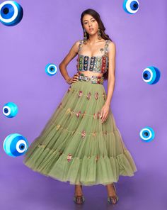 A tiered tulle half Lehenga in moss green embellished with glass stones and metal pieces. Paired with an original Papa Don't Preach tab bralette in lilac embellished with glass cut beads.From Papa Don’t Preach’s Nazar Na Lage collection. DELIVERY TIMEPlease allow 8-12 weeks for your outfit to arrive. FABRIC DETAILSTulle. Professional cleaning only. Saree Jumpsuit, Half Lehenga, Tulle Lehenga, Papa Don't Preach, Evil Eye Beads, Embroidery Materials, Georgette Blouse, Pink Tulle, Eye Beads