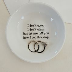 two wedding rings in a bowl with the words i don't cook, i don't clean but let me tell you how i got this ring