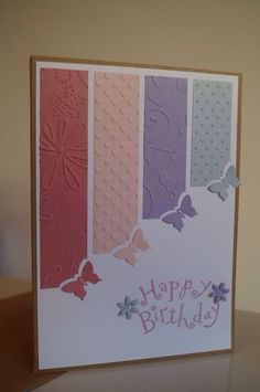 a card with butterflies on it and the words happy birthday written in pink, blue, purple