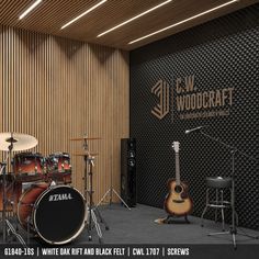 a recording studio with guitars and drums in front of a wall that has the words dw wildcraft on it