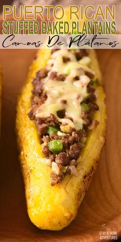 an image of stuffed baked plantains with cheese and meat on it in a wooden bowl