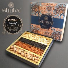 an assortment of nuts and dried fruits in a gift box with the words, diwali special & dryfruits gift box