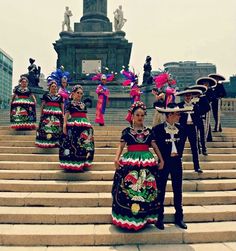 some people are dressed up and standing on some steps