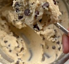 a spoon full of ice cream with chocolate chips