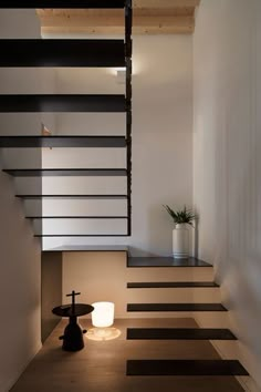 a modern staircase with black and white stripes