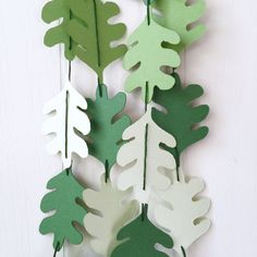 green and white paper leaves hanging from a string