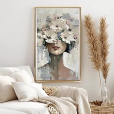 a painting on the wall above a bed in a room with white sheets and pillows