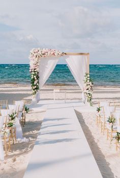 an outdoor wedding setup on the beach