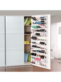 an open closet with several pairs of shoes in it