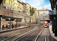 people are walking on the train tracks next to an empty station with a red and white train