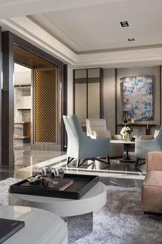 an elegant living room with modern furniture and decor