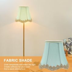 a lamp shade on a table next to a chair