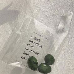 three green avocados sitting on top of a plastic bag with the words, a sleek revealing clear, no privacy