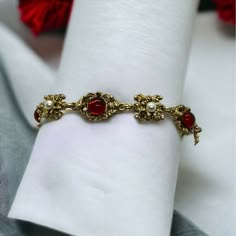 This Vintage Gold Tone Bracelet With Faux Pearl And Red Gem Detailing Adds An Elegant Touch To Any Outfit. Its 7.5" Length Ensures A Comfortable Fit. Gold Tone Link Bracelet Faux Pearl Accents Eye-Catching Red Gem Vintage Style Comfortable 7.5" Size Size: Womens 7.5" Condition: New With Box Check Out My Bundle Discount! Put Four Or More Items In Your Bundle And I'll Also Give Free Shipping! Gold Bracelet Vintage, Red And Gold Jewelry Aesthetic, Red Jubilee Bracelets For Parties, Red Jubilee Bracelet For Party, Red Metal Bracelets For Festive Occasions, Vintage Red Jewelry With Jubilee Bracelet, Red Vintage Jewelry With Jubilee Bracelet, Vintage Red Bracelets For Party, Red Vintage Party Bracelets