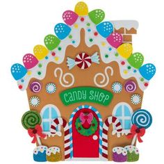 a gingerbread house with candy and candies on the front, decorated in bright colors