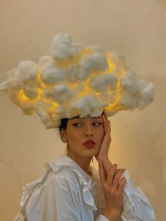 a woman with a cloud hat on her head