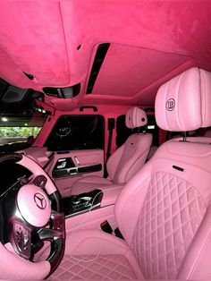 the interior of a car with pink leather