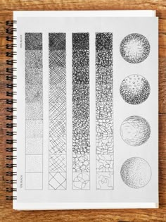 an open notebook with drawings on it and some pencils in front of the pages