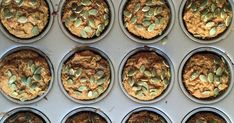 twelve muffins with pumpkin seeds are in the baking tin and ready to be baked