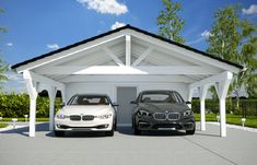 two cars parked in front of a white house