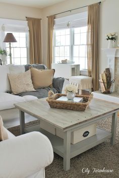 a living room filled with furniture and a fire place