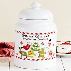 a white cookie jar with christmas cookies on it