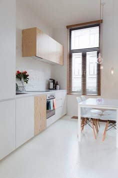 a white table and chairs in a room