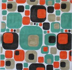 an orange, green and black rug with circles on the bottom in various shades of brown