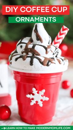 a red cup filled with hot chocolate and whipped cream