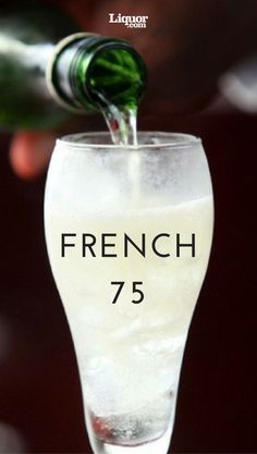 a wine glass filled with white wine being poured into it and the words french 75 written in black