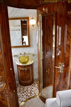 a bathroom with wooden walls and tile flooring