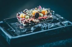 a close up of food on a black plate