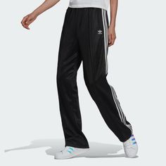 ADIDAS ADICOLOR CLASSICS HIGH-SHINE STRAIGHT-LEG TRACK PANTS BLACK -X-SMALL . Ships USPS First Class.  SHINY, COZY TRACK PANTS MADE IN PART WITH RECYCLED MATERIALS. An easy addition to any outfit, these adidas Adicolor track pants elevate your look. We're refreshing an iconic sports-heritage silhouette with high-shine fabric and contrasting 3-Stripes. You'll feel cozy and look luxe when out with friends or lounging at home.  SPECIFICATIONS Loose fit with high rise Drawcord on elastic waist 57% r Adidas Sport Pants, Adidas Adicolor, Track Pants Women, Leg Pants Outfit, Active Wear Pants, Adidas Pants, Athletic Pants, Adidas Online, Sport Pants