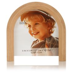 a wooden arch with an image of a young boy in the center and white background