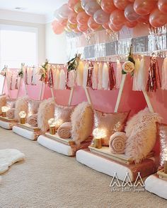 a room filled with lots of balloons and decorations