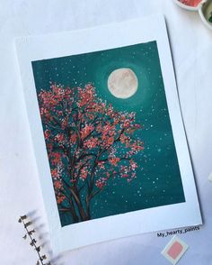 a painting of a tree with the moon in the background and some watercolor paints