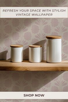 three white canisters on a shelf with the words refresh your space with stylish vintage wallpaper