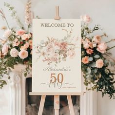 an easel with a sign that says welcome to alexandria's 50th