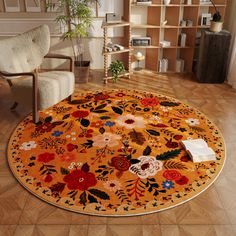 a living room area with a chair, rug and bookshelf on the floor