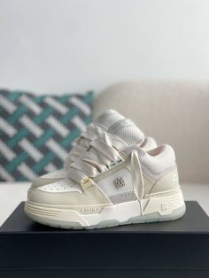 Step into effortless style with these AMIRI MA-1-inspired sneakers in a clean and contemporary beige and white colorway. Crafted with premium materials, these high-top sneakers capture the essence of AMIRI's signature aesthetic. The bold silhouette, featuring an exaggerated sole and signature details like the AMIRI logo on the side and tongue, exudes confidence and individuality. Experience the perfect fusion of comfort, quality, and head-turning style. Your order arrives in a branded shoe box, Shoes Snapchat Story, Amiri Shoes, Amiri Sneakers, Amiri Logo, Signature Aesthetic, Beige Sneakers, Fall Winter Jacket, Loafer Sneakers, Bottega Veneta Shoulder Bag