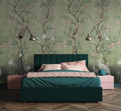 a bedroom with green wallpaper and pink bedding, two lamps on either side of the bed