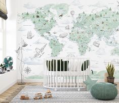 a baby's room with a world map wallpaper