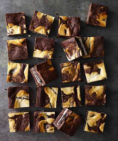 chocolate brownies with caramel swirl and oreo cookies on top, cut into squares