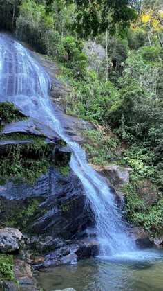 there is a large waterfall in the woods