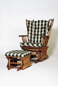 an old rocking chair and ottoman with checkered fabric on the seat cushion is sitting in front of a white background