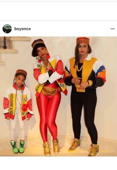 two women and a child are dressed up in costumes that look like they're from the 80s